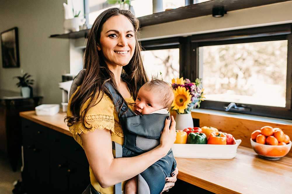 Allison Schaaf cooking with baby