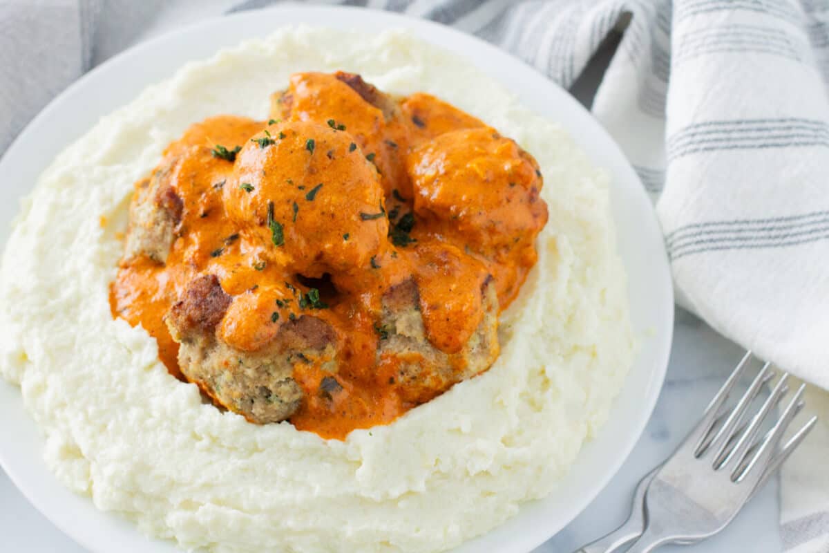 Low Carb Turkey Meatballs w/ Creamy Red Pepper Coconut Sauce Over Cauli Mash - PrepDish.com